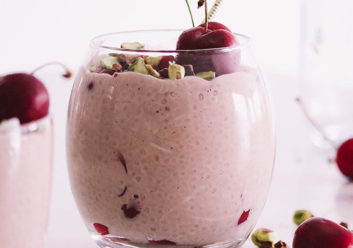 cherry chia pudding an easy breakfast recipe high in protein and high in fibre to make ahead the night before topped with fresh cherries, cacao nibs and pistachios